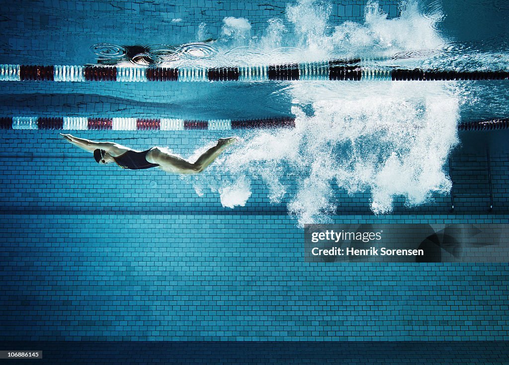 Female swimmer underwater in pool
