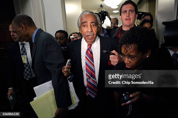 Rep. Charlie Rangel is pursued by reporters and photographers after unexpectedly leaving his House of Representatives ethics committee hearing in the...