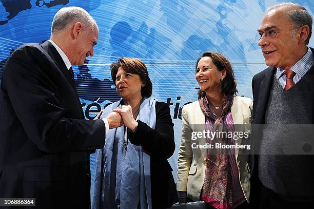 George Papandreou, Greece's prime minister, left, Martine Aubry, leader of the opposition Socialist Party, center left, Segolene Royal, former...