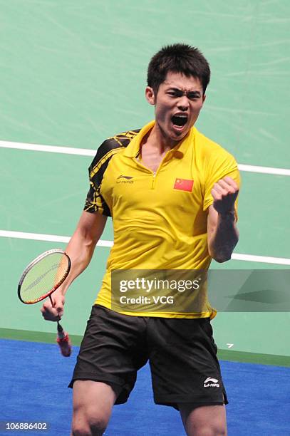 Lin Dan of China celebrates after defeating Sunghwan Park of South Korea during the men's team badminton final at Tianhe Gymnasium during day three...