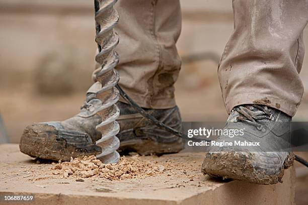 construction man and tool - builders boots stock pictures, royalty-free photos & images
