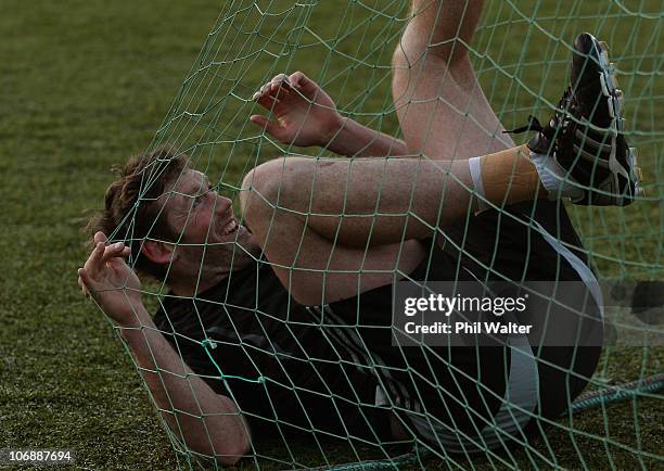 Tom Donnelly of the All Blacks gets caught in the net during a New Zealand All Blacks recovery session at Westmanstown on November 15, 2010 in...