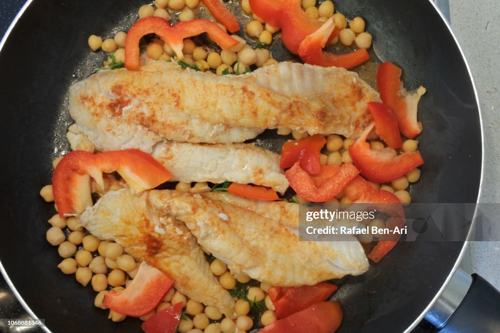 Fresh Slices of Fish Cooked in a Frying Pan