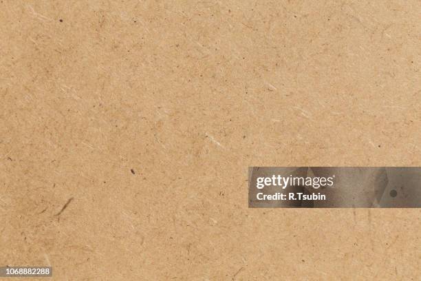 pressed beige chipboard texture. wooden background - chipboard paper stock pictures, royalty-free photos & images