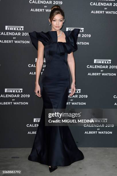 Model Gigi Hadid poses on the red carpet upon her arrival at the 2019 Pirelli Calendar international launch gala at the Pirelli HangarBicocca in...