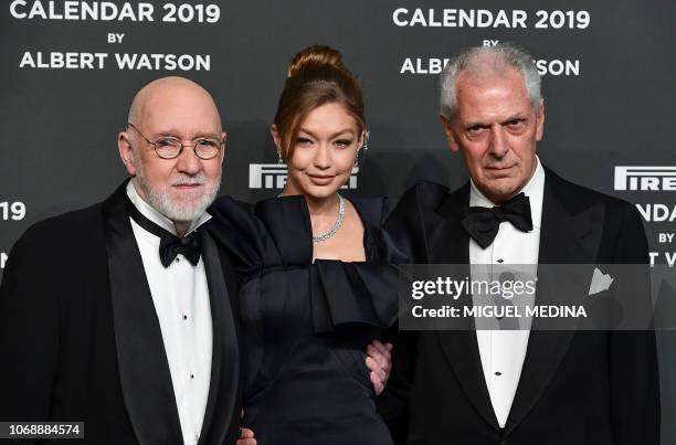 Scottish photographer Albert Watson , US model Gigi Hadid and Pirelli's CEO Marco Tronchetti Provera pose on the red carpet upon their arrival at the...