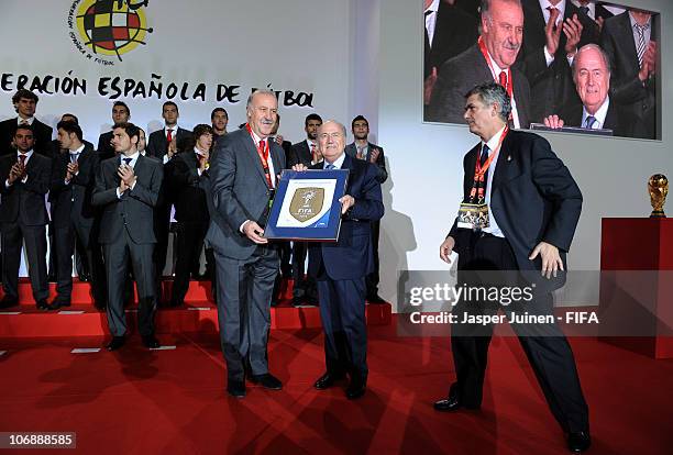President Sepp Blatter hands over the FIFA World Champions Badge to Spanish Head coach Vicente del Bosque flanked by the President of the Spanish...