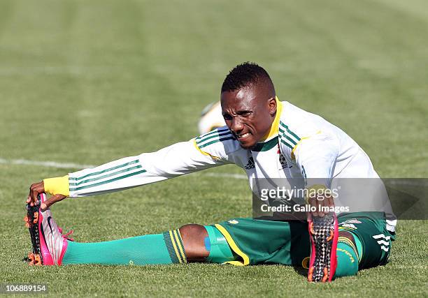 Teko Modise of South Africa stretches during a South Africa team training session ahead of the Nelson Mandela Challenge Cup match against the USA at...