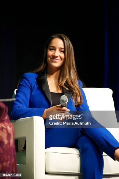 Captain of the gold medal-winning US Olympic women's gymnastics teams in 2012 and 2016 Aly Raisman speaks on stage during 2018 Massachusetts...