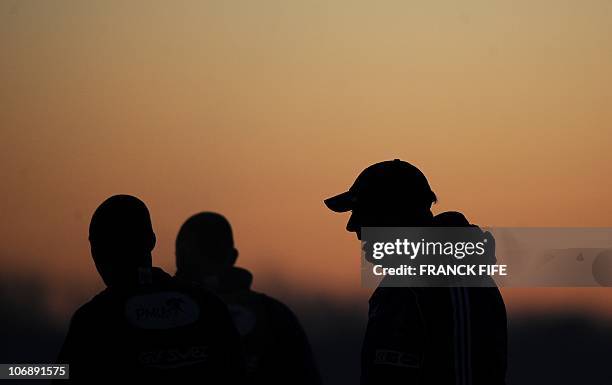 French football national team coach Laurent Blanc looks at his players during a training session on November 15 at Arsenal's Training facility in...