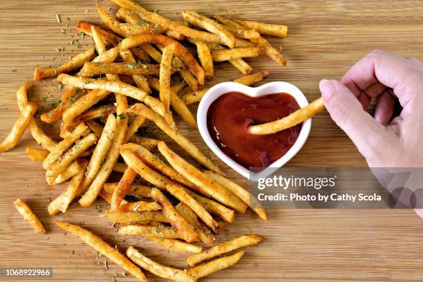 french fries and ketchup - dippen stock-fotos und bilder