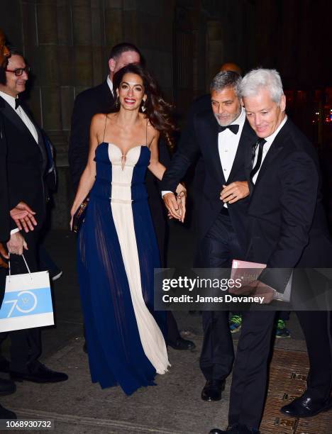 Amal Clooney and George Clooney leave Cipriani 42nd Street on December 5, 2018 in New York City.