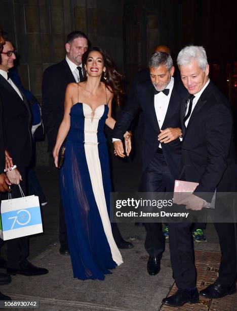 Amal Clooney and George Clooney leave Cipriani 42nd Street on December 5, 2018 in New York City.