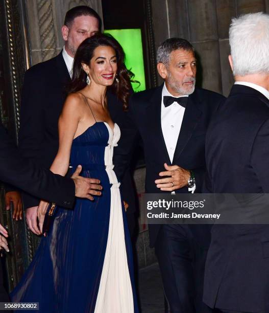 Amal Clooney and George Clooney leave Cipriani 42nd Street on December 5, 2018 in New York City.