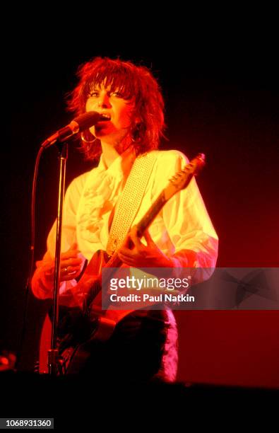 American musician Chrissie Hynde, of the group Pretenders, plays guitar as she performs at the UIC Pavilion, Chicago, Illinois, May 24, 1982.
