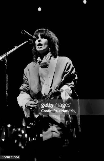 American musician Chrissie Hynde, of the group Pretenders, plays guitar as she performs at the UIC Pavilion, Chicago, Illinois, May 24, 1982.
