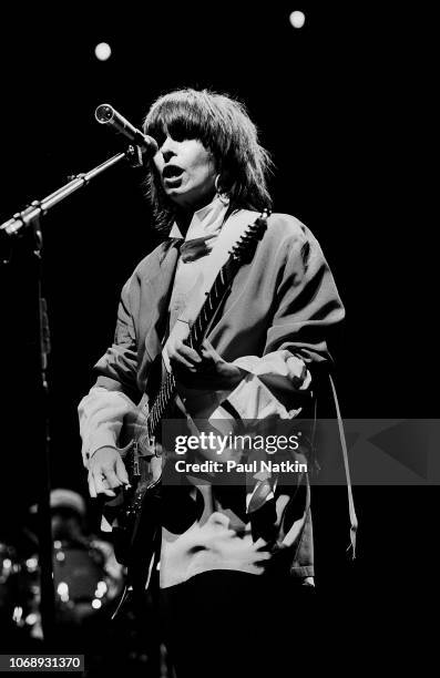 American musician Chrissie Hynde, of the group Pretenders, plays guitar as she performs at the UIC Pavilion, Chicago, Illinois, May 24, 1982.