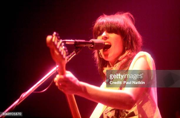 American musician Chrissie Hynde, of the group Pretenders, plays guitar as she performs at the Park West, Chicago, Illinois, April 25, 1980.