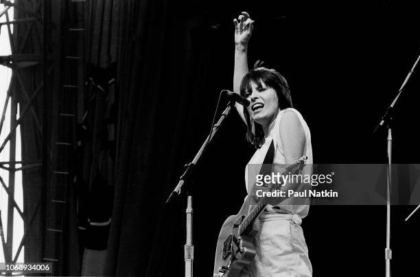 American musician Chrissie Hynde, of the group Pretenders, plays guitar as she performs at the US Festival, Ontario, California, May 30, 1983.