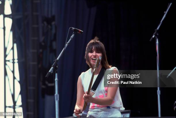 American musician Chrissie Hynde, of the group Pretenders, plays guitar as she performs at the US Festival, Ontario, California, May 30, 1983.