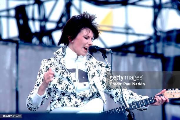 American musician Chrissie Hynde, of the group Pretenders, plays guitar as she performs during the Live Aid concert at Veteren's Stadium,...