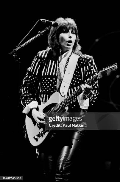 American musician Chrissie Hynde, of the group Pretenders, plays guitar as she performs at the Poplar Creek Music Theater in Hoffman Estates,...