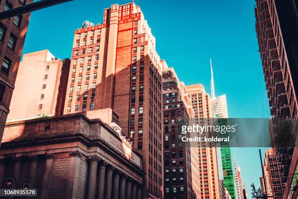 urban skyline . fifth avenue , midtown manhattan - taking a vintage ny taxi cab stock pictures, royalty-free photos & images