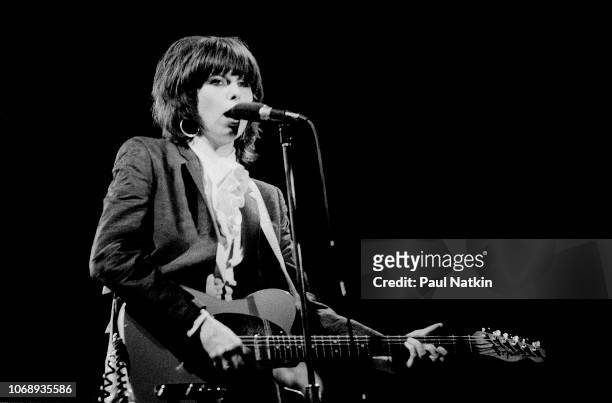 American musician Chrissie Hynde, of the group Pretenders, plays guitar as she performs at the Aragon Ballroom in Chicago, Illinois, August 22, 1981.