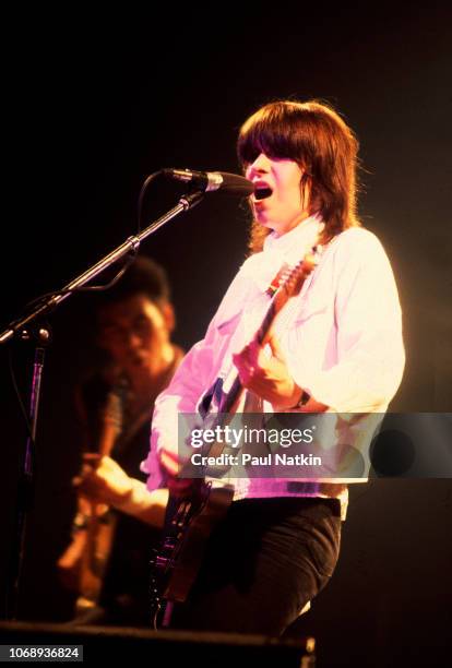 American musician Chrissie Hynde, of the group Pretenders, plays guitar as she performs at the Riviera Theater, Chicago, Illinois, September 8, 1980.