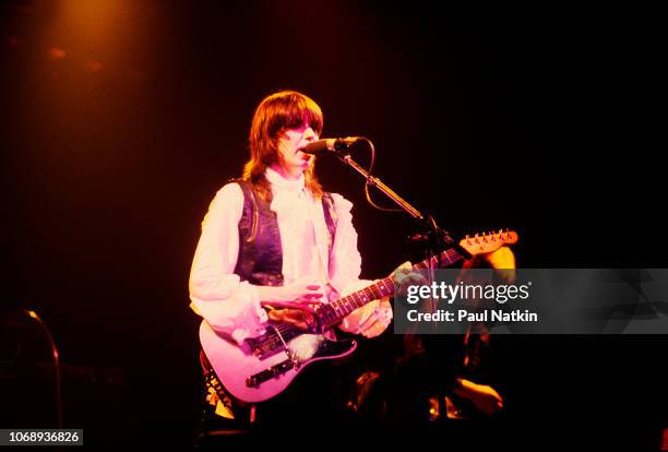 American musician Chrissie Hynde, of the group Pretenders, plays guitar as she performs at the Riviera Theater, Chicago, Illinois, September 8, 1980.