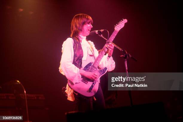 American musician Chrissie Hynde, of the group Pretenders, plays guitar as she performs at the Riviera Theater, Chicago, Illinois, September 8, 1980.
