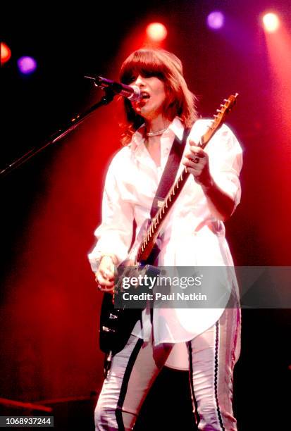 American musician Chrissie Hynde, of the group Pretenders, plays guitar as she performs at the Rosemont Horizon, Rosemont, Illinois, November 1, 1994.