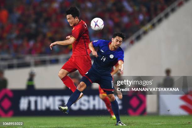 Philippines' midfielder Kevin Ingreso fights for the ball with Vietnam's midfielder Luong Xuan Truong during the second leg of the AFF Suzuki Cup...