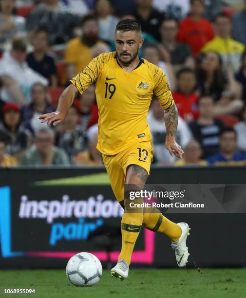 Josh Risdon of Australia runs with the ball during the International Friendly match between the Australian Socceroos and Korea Republic at Suncorp...