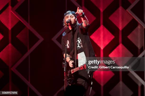 Musician Michael Clifford of 5 Seconds of Summer performs during Q102's Jingle Ball 2018 at Wells Fargo Center on December 5, 2018 in Philadelphia,...