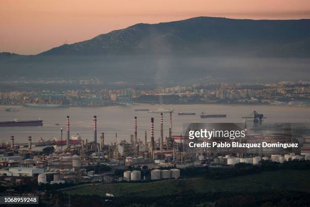 The Gibraltar-San Roque Refinery is seen at sunrise as Algeciras stands on the back on December 6, 2018 in La Linea de la Concepcion, Spain. More...