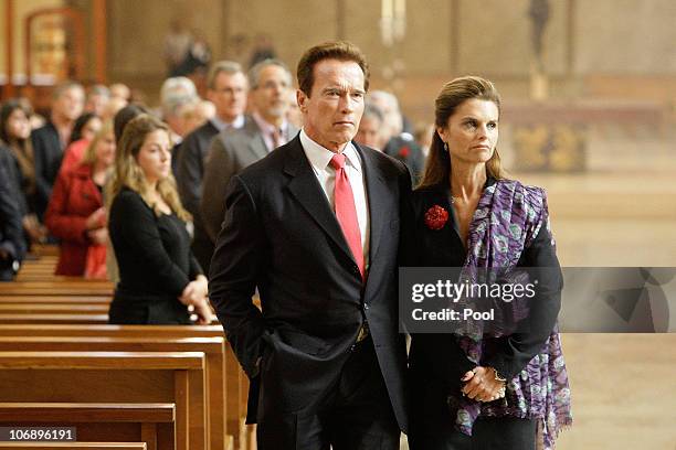 California Governor Arnold Schwarzenegger and wife Maria Shriver attend the funeral Mass for Italian film mogul and Hollywood producer Dino De...