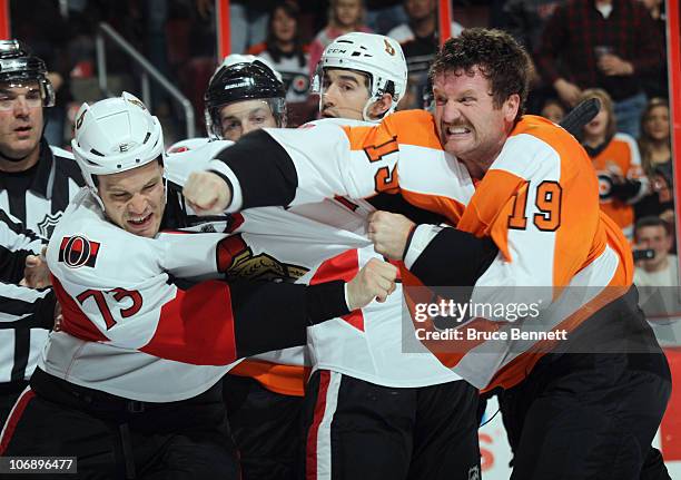 Jarkko Ruutu of the Ottawa Senators receives a punch from Scott Hartnell of the Philadelphia Flyers at the Wells Fargo Center on November 15, 2010 in...