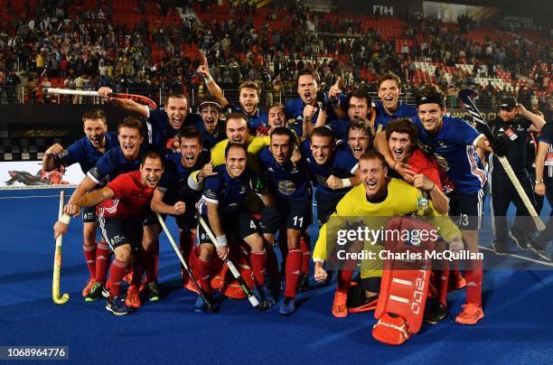 Players of France celebrate after the final whistle during the FIH Men's Hockey World Cup Pool A match between Argentina and France at Kalinga...