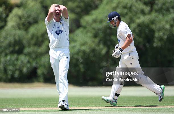 Colin de Grandhomme of the Aces takes a run as Ian Butler of the Volts reacts after a close catching opportunity during day one of the Plunket Shield...