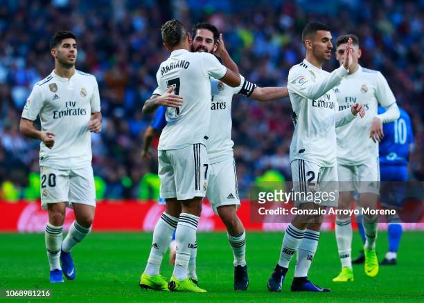 Isco of Real Madrid celebrates after scoring his team's fourth goal with Mariano Diaz and team mates during the Copa del Rey fourth round match...