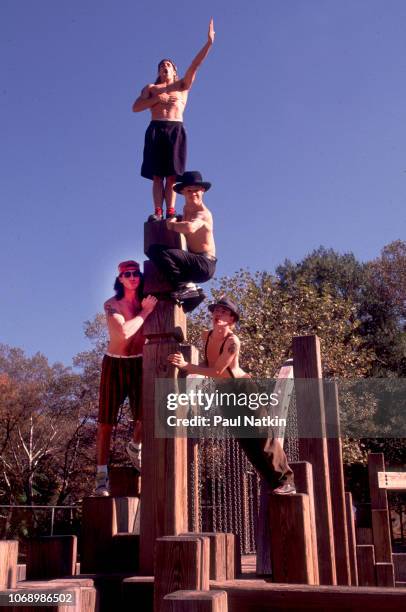 Portrait of the Red Hot Chili Peppers, top to bottom, Anthony Kiedis, John Frusciante, Chad Smith, and Flea in Central Park in New York, New York,...