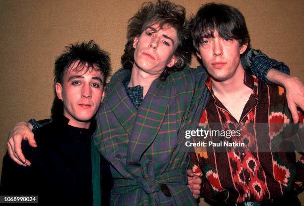 Portrait of, from left, British musicians John Ashton and brothers Richard Butler & Tim Butler, all of the Psychedelic Furs, as they pose backstage...