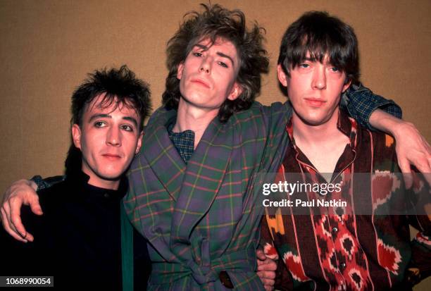 Portrait of, from left, British musicians John Ashton and brothers Richard Butler & Tim Butler, all of the Psychedelic Furs, as they pose backstage...