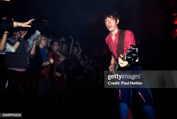 British musician Tim Butler of the Psychedelic Furs plays bass guitar as he performs onstage at the Riviera Theater, Chicago, Illinois, November 9,...