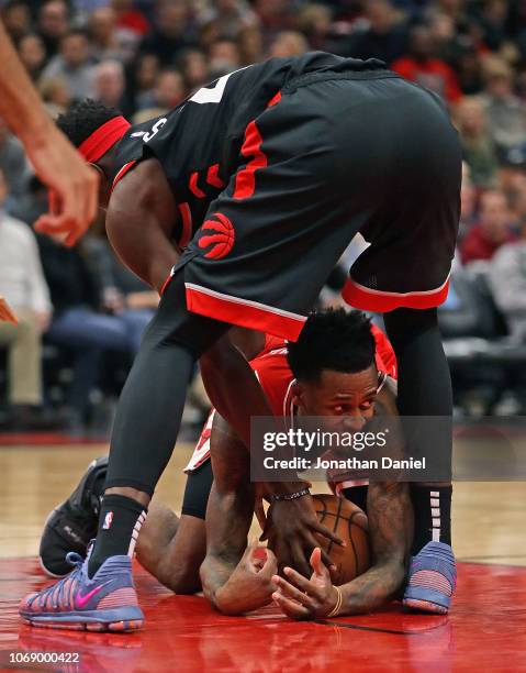 Antonio Blakeney of the Chicago Bulls tries to keep control of the ball under Pascal Siakam of the Toronto Raptors at United Center on November 17,...