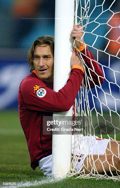 Francesco Totti of Roma clings onto the goal post during the Serie A 6th Round League match between Roma and Brescia played at the Olympic stadium in...