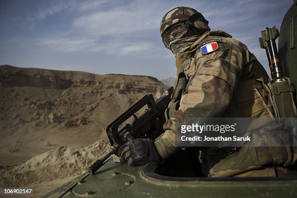 French soldier of the 2nd Regiment Engineers of the Foreign Legion, attached to the 27 me Bataillon de Chasseurs Alpins of the French Army, watches...