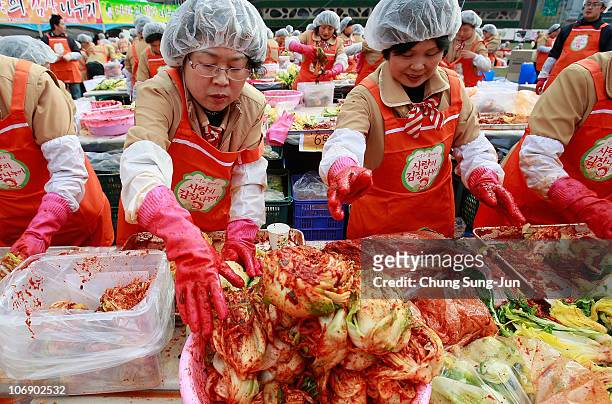 Thousands of housewives make Kimchi for donation to the poor in preparation for winter in front of City Hall on November 16, 2010 in Seoul, South...