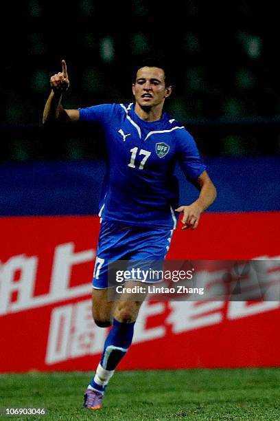 Nagaev Ivan of Uzbekistan Done celebrates scoring in the 1/8 final at University Town Main Stadium during day three of the 16th Asian Games Guangzhou...